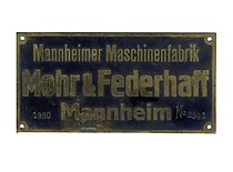Lietuvos universiteto Technikos fakulteto Mechaninės medžiagų atsparumo laboratorijos Mohro-Federhafo bandymo mašinos lentelė, 1927 m. (Originalas – KTU muziejuje)
